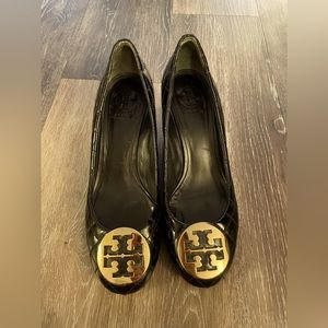 Tory Burch size 10 quilted black patent leather closed toe wedge heels.